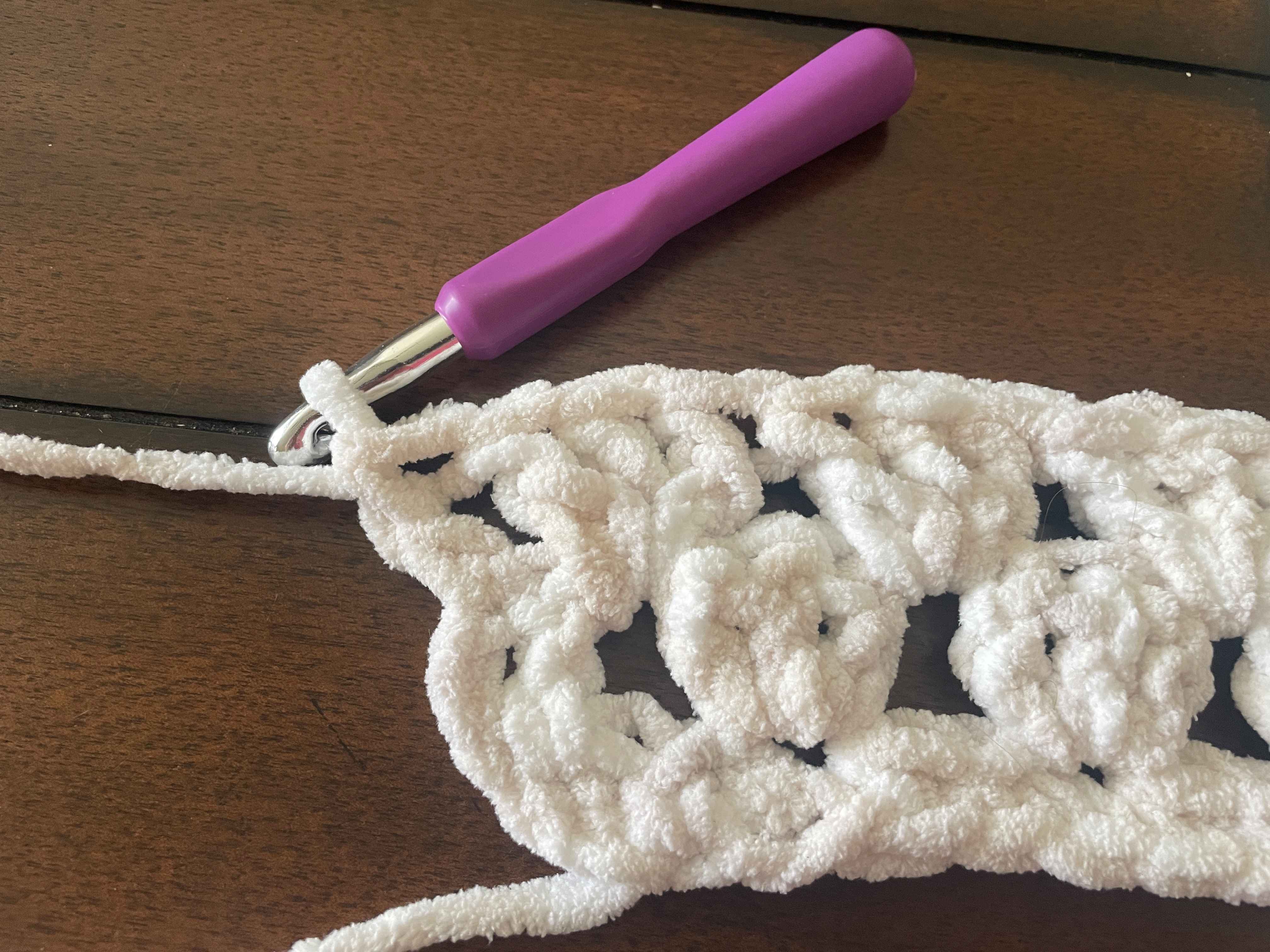 double Crochet stitch in the top of the chain 3 stitch below